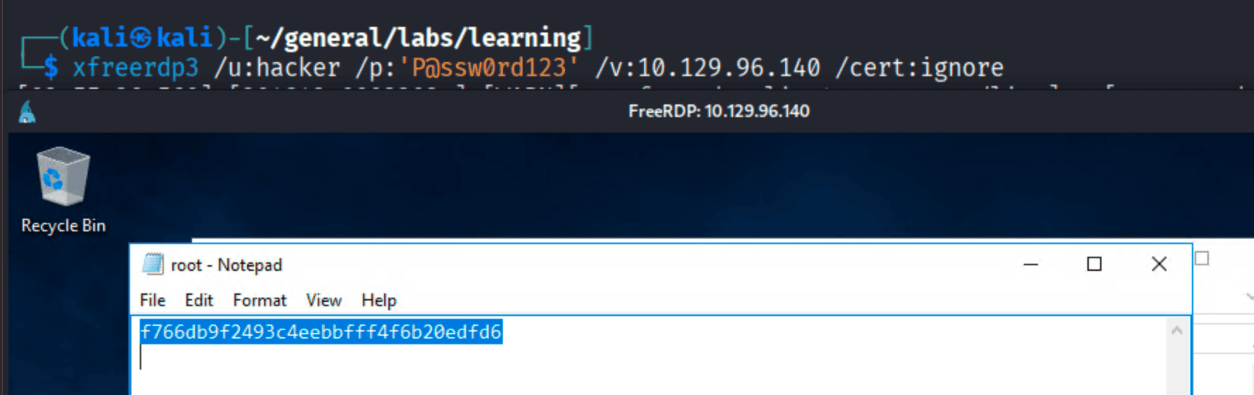 xfreerdp RDP session as hacker showing root.txt open in Notepad with the flag